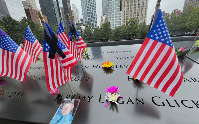 Flags and flowers are placed in the inscribed names at the National September 11 Memorial in New York, September 10, 2025. (AP Photo/Donald King) Flags and flowers are placed in the inscribed names at the National September 11 Memorial in New York, September 10, 2025. (AP Photo/Donald King)