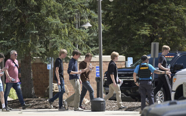 Students walk to board a bus amid heavy police presence at the Evergreen Library after a shooting at Evergreen High School in Evergreen, Colorado, September 10, 2025. (Hyoung Chang/The Denver Post via AP) Students walk to board a bus amid heavy police presence at the Evergreen Library after a shooting at Evergreen High School in Evergreen, Colorado, September 10, 2025. (Hyoung Chang/The Denver Post via AP)