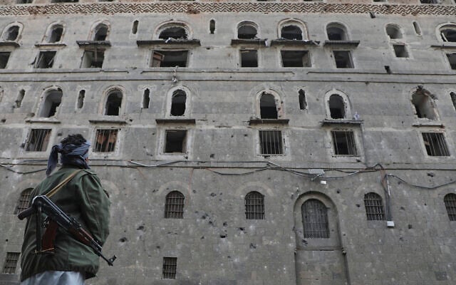 A man inspects the damage at the National Museum, following Israeli airstrikes, in Sanaa, Yemen, September 11, 2025. (AP Photo/Osamah Abdulrahman)
