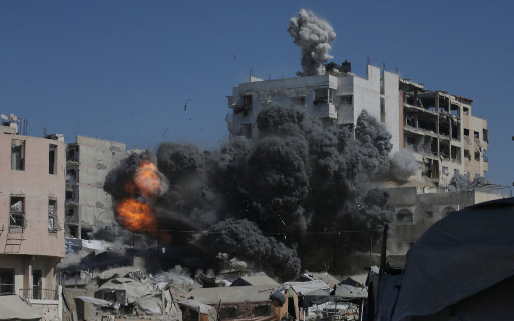Smoke and flames rise after an Israeli military strike on a building in Gaza City, Sept. 12, 2025. (AP Photo/Yousef Al Zanoun)