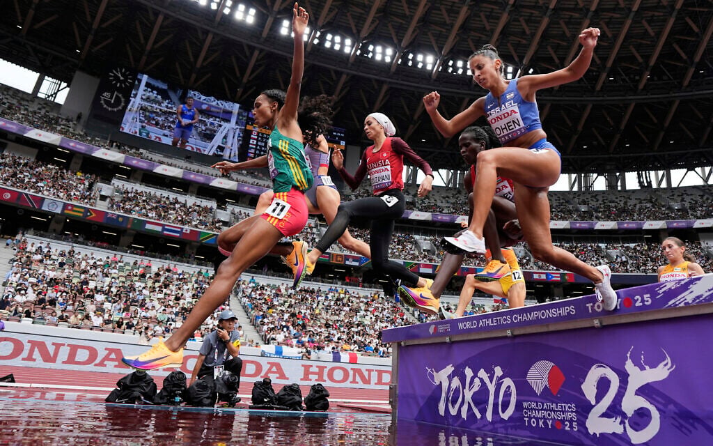 Runners, including Israel's Adva Cohen, compete in a heat of the women's 3,000 meters steeplechase at the World Athletics Championships in Tokyo, Monday, September 15, 2025. (AP/Ashley Landis)