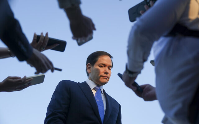 US Secretary of State Marco Rubio listens as he speaks to media at Ben Gurion International Airport, as he departs Tel Aviv for Qatar following an official visit on September 16, 2025. (Nathan Howard/Pool Photo via AP)