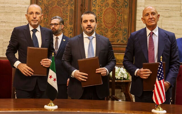 US Ambassador to Turkey and Special Envoy to Syria Tom Barrack, right, Jordanian Foreign Minister Ayman Safadi, left, and Syrian Foreign Minister Asaad al-Shaibani pose for a photograph after signing a roadmap to restore security in southern Syria, in Damascus, Syria, September 16, 2025. (AP Photo/Ghaith Alsayed) US Ambassador to Turkey and Special Envoy to Syria Tom Barrack, right, Jordanian Foreign Minister Ayman Safadi, left, and Syrian Foreign Minister Asaad al-Shaibani pose for a photograph after signing a roadmap to restore security in southern Syria, in Damascus, Syria, September 16, 2025. (AP Photo/Ghaith Alsayed)