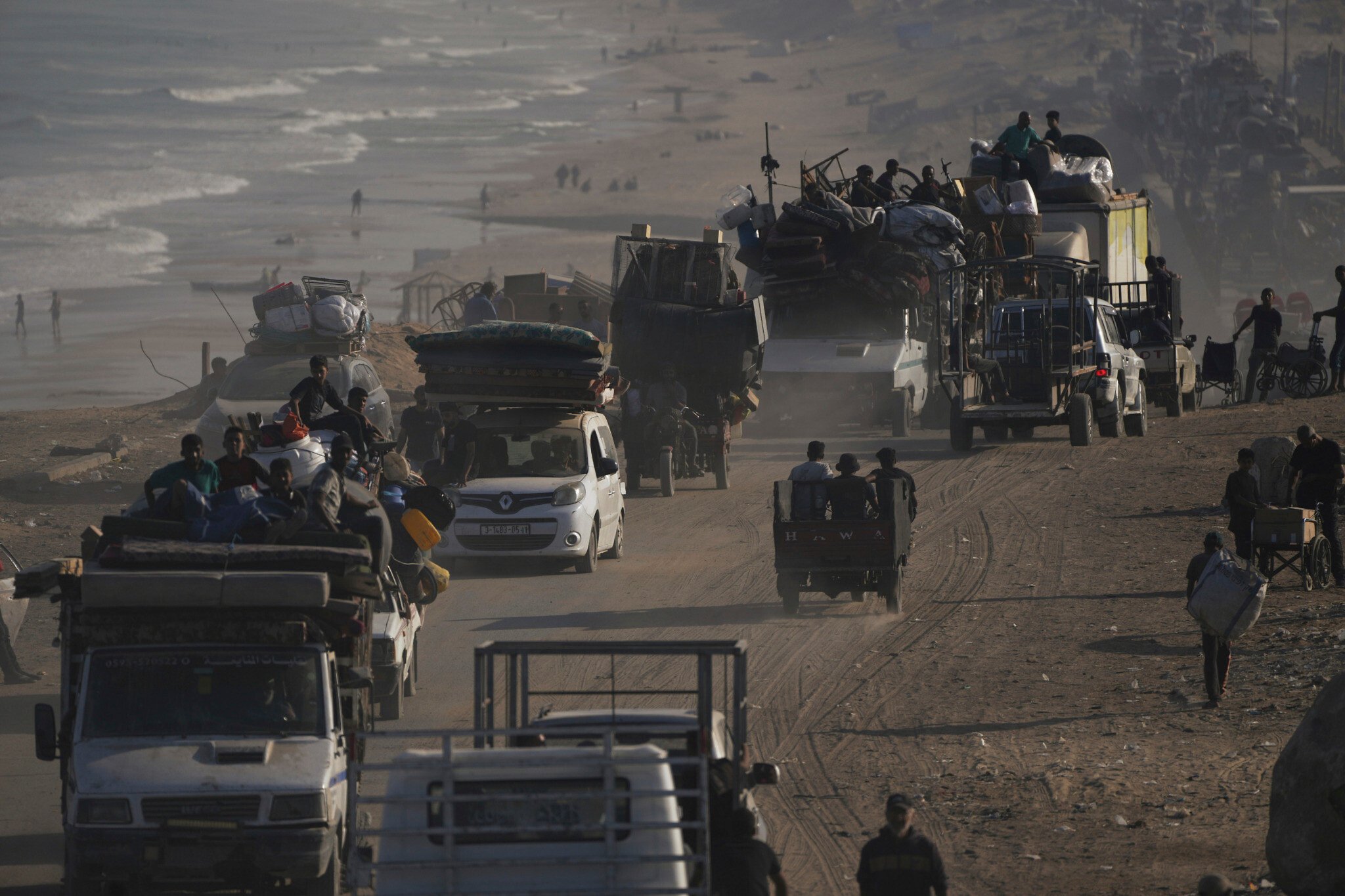 NextImg:Dozens said killed in strikes as thousands flee Gaza City, but some vow to stay put