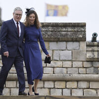 British Prime Minister Sir Keir Starmer and wife, Lady Victoria Starmer, arrive for the Beating Retreat military ceremony at Windsor Castle, England, on Wednesday Sept. 17, 2025, on day one of US President Donald Trump's second state visit to the UK. (Andrew Matthews/PA via AP, Pool)