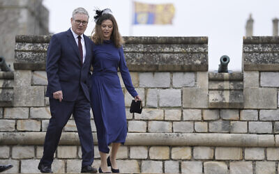 British Prime Minister Sir Keir Starmer and wife, Lady Victoria Starmer, arrive for the Beating Retreat military ceremony at Windsor Castle, England, on September 17, 2025, on day one of US President Donald Trump's second state visit to the UK. (Andrew Matthews/PA via AP, Pool)
