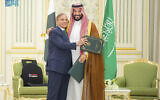 Pakistani Prime Minister Shehbaz Sharif, left, embraces Saudi Arabia's Crown Prince Mohammed bin Salman after signing a joint defense pact in Riyadh, Saudi Arabia, September 17, 2025. (Saudi Press Agency via AP)