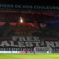 A giant banner reading 'Free Palestine' is displayed before the Champions League opening phase soccer match between Paris Saint Germain and Atletico Madrid at the Parc des Princes stadium in Paris on November 6, 2024. (AP/Michel Euler)