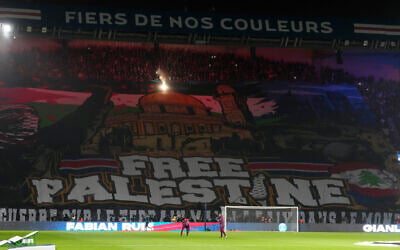 A giant banner reading 'Free Palestine' is displayed before the Champions League opening phase soccer match between Paris Saint Germain and Atletico Madrid at the Parc des Princes stadium in Paris on November 6, 2024. (AP/Michel Euler)