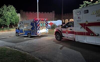 Ambulances are parked outside a hotel acting as a reunification center after a shooting at a country club in Nashua, New Hampshire, on September 20, 2025. (AP/Michael Casey)