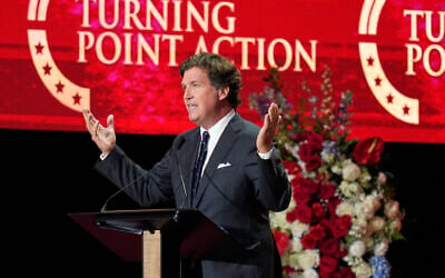 Tucker Carlson speaks at a memorial for conservative activist Charlie Kirk, September 21, 2025, at State Farm Stadium in Glendale, Arizona. (AP Photo/John Locher) Tucker Carlson speaks at a memorial for conservative activist Charlie Kirk, September 21, 2025, at State Farm Stadium in Glendale, Arizona. (AP Photo/John Locher)