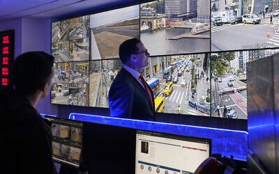 US Secret Service Special Agent in Charge Matt McCool, center, looks at live video surveillance feeds in the agency's New York Field Office, in the Brooklyn borough of New York, Sept. 22, 2025. (AP Photo/Richard Drew)