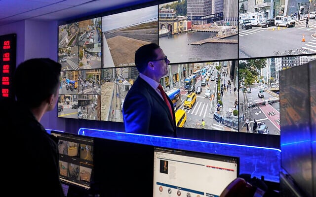 US Secret Service Special Agent in Charge Matt McCool, center, looks at live video surveillance feeds in the agency's New York Field Office, in the Brooklyn borough of New York, Sept. 22, 2025. (AP Photo/Richard Drew)