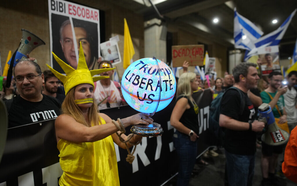 People take part in a protest demanding the end of the war and immediate release of hostages held by Hamas in the Gaza Strip, and against Prime Minister Benjamin Netanyahu's government at Ben Gurion Airport on Sept. 24, 2025. (AP/Ohad Zwigenberg)