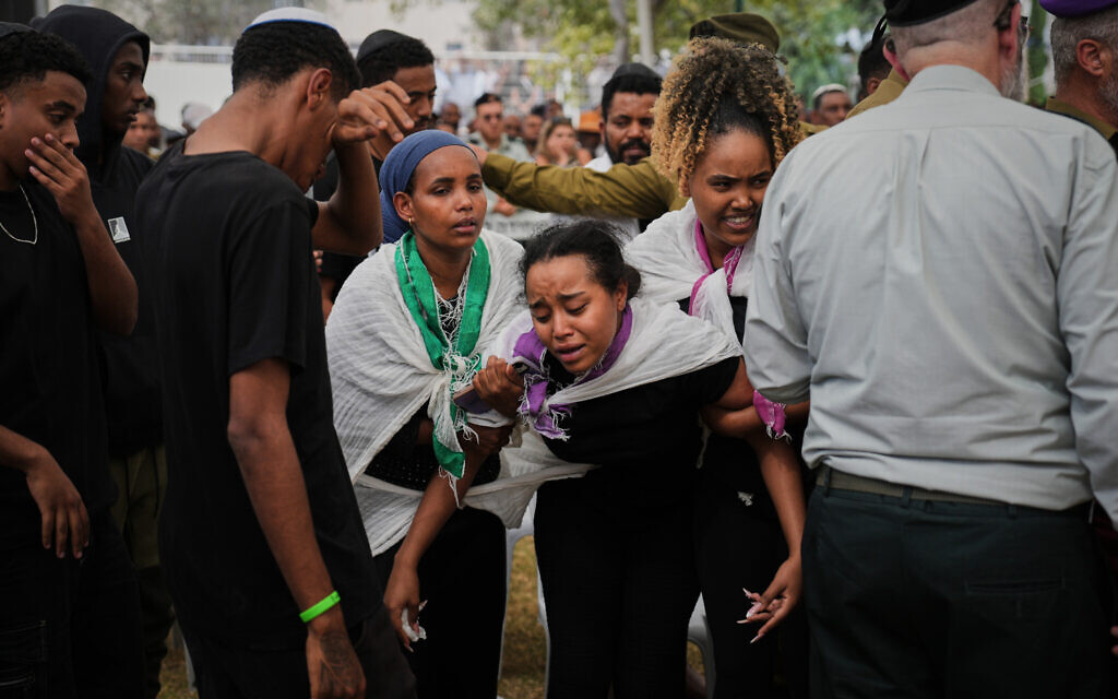 Mourners attend the funeral of Staff Sgt. Chalachew Shimon Demalash, who was killed in a battle in the Gaza Strip, during his funeral at the military cemetery in Beersheba, Israel, September 25, 2025. (AP Photo/Ohad Zwigenberg) Mourners attend the funeral of Staff Sgt. Chalachew Shimon Demalash, who was killed in a battle in the Gaza Strip, during his funeral at the military cemetery in Beersheba, Israel, September 25, 2025. (AP Photo/Ohad Zwigenberg)