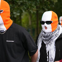 Members of the band Kneecap arrive at Woolwich Crown Court in London on September 26, 2025. (AP/Joanna Chan)