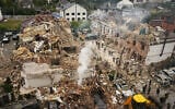 Rescuers work at the site of an apartment building damaged during a Russian attack in Kyiv, Ukraine, September 28, 2025. (AP Photo/Efrem Lukatsky)