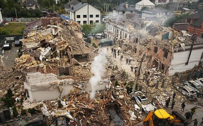 Rescuers work at the site of an apartment building damaged during a Russian attack in Kyiv, Ukraine, September 28, 2025. (AP Photo/Efrem Lukatsky)