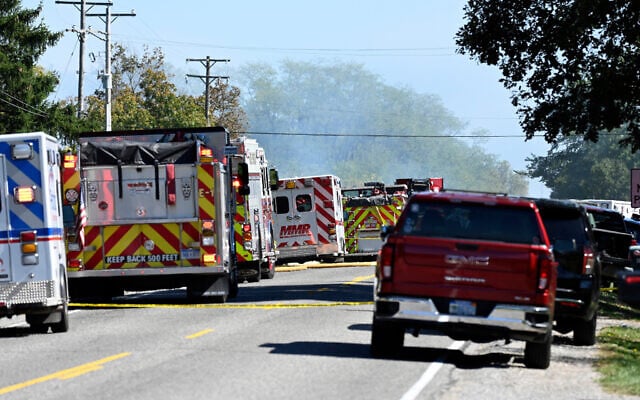 Fire and EMS vehicles are parked along McCandlish Road near a shooting that took place at The Church of Jesus Christ of Latter-day Saints, Septeber 28, 2025, in Grand Blanc, Mich. (AP Photo/Jose Juarez)