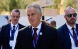 Britain's former prime minister Tony Blair walks through the COP28 UN Climate Summit, in Dubai, United Arab Emirates, December 3, 2023. (Rafiq Maqbool/AP)