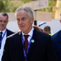 Britain's former prime minister Tony Blair walks through the COP28 UN Climate Summit, in Dubai, United Arab Emirates, December 3, 2023. (Rafiq Maqbool/AP)
