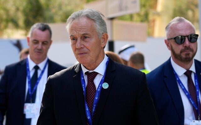 Britain's former prime minister Tony Blair walks through the COP28 UN Climate Summit, in Dubai, United Arab Emirates, December 3, 2023. (Rafiq Maqbool/AP)