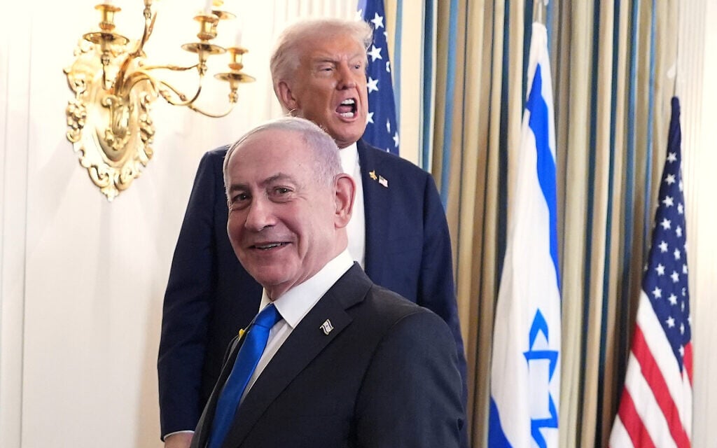 US President Donald Trump speaks upon departing a news conference with Prime Minister Benjamin Netanyahu, in foreground, in the State Dining Room of the White House, September 29, 2025, in Washington. (AP/Evan Vucci)