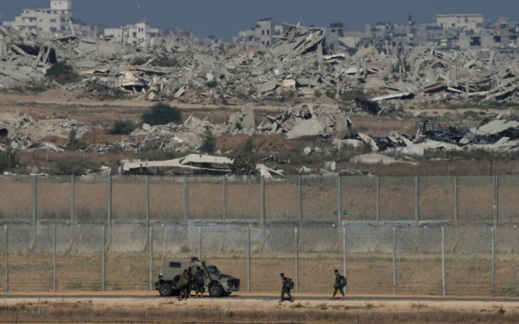 Israeli troops are seen near the Gaza Strip border in southern Israel, Tuesday, Sept. 30, 2025. (AP/Ohad Zwigenberg)