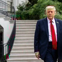 US President Donald Trump walks to speak with reporters before departing on Marine One from the South Lawn of the White House, on September 30, 2025, in Washington. (AP Photo/Alex Brandon)