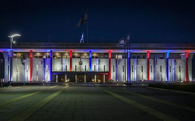 The Knesset lit up in red, white and blue on September 11, 2025 to mark the assassination of American right-wing activist Charlie Kirk. (Dani Shem-Tov/ Office of the Knesset Spokesperson)