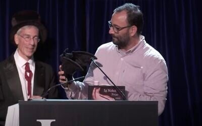 Screen capture from video of Francisco Sanchéz receiving an Ig Noble prize for Ben Gurion University's research on drunken bats, September 18, 2025. (YouTube)