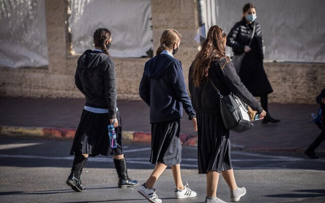 Illustrative: Ultra-Orthodox girls make their way to school in Jerusalem, November 24, 2020. (Yonatan Sindel/Flash90) Illustrative: Ultra-Orthodox girls make their way to school in Jerusalem, November 24, 2020. (Yonatan Sindel/Flash90)