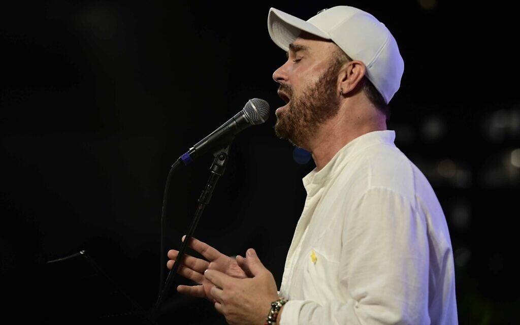 Pro-Palestinian activist throws red paint on Israeli singer at concert in Warsaw