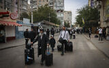 Jewish visitors seen in the street of Uman, ahead of the Jewish holiday of Rosh Hashanah, September 30, 2024. (Chaim Goldberg/ Flash90/ File)