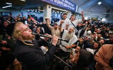 Jewish men sing and dance at the tomb of Rabbi Nachman of Breslov in Uman, ahead of the Jewish holiday of Rosh Hashanah, September 30, 2024. (Chaim Goldberg/Flash90)