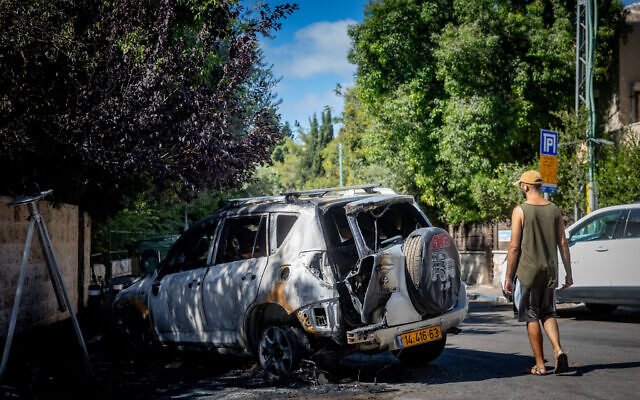 View of a car burned after a garbage bin was set on fire by protesters demanding the release of the hostages in Gaza, near the Prime Minister’s residence in Jerusalem, September 3, 2025. (Chaim Goldberg/Flash90) View of a car burned after a garbage bin was set on fire by protesters demanding the release of the hostages in Gaza, near the Prime Minister’s residence in Jerusalem, September 3, 2025. (Chaim Goldberg/Flash90)
