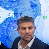 Finance Minister Bezalel Smotrich gestures toward a map of the West Bank during a press conference at the Finance Ministry in Jerusalem, September 3, 2025. (Yonatan Sindel/Flash90)