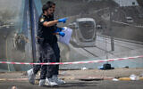 Police and rescue personnel at the scene of a terror attack at Ramot Junction, Jerusalem, September 8, 2025. (Chaim Goldberg/Flash90)