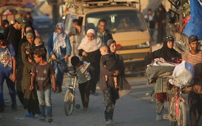 Palestinians who fled combat zones in the Gaza Strip arrive in at the Nuseirat refugee camp, in central Gaza, September 14, 2025. (Ali Hassan/ Flash90) Palestinians who fled combat zones in the Gaza Strip arrive in at the Nuseirat refugee camp, in central Gaza, September 14, 2025. (Ali Hassan/ Flash90)
