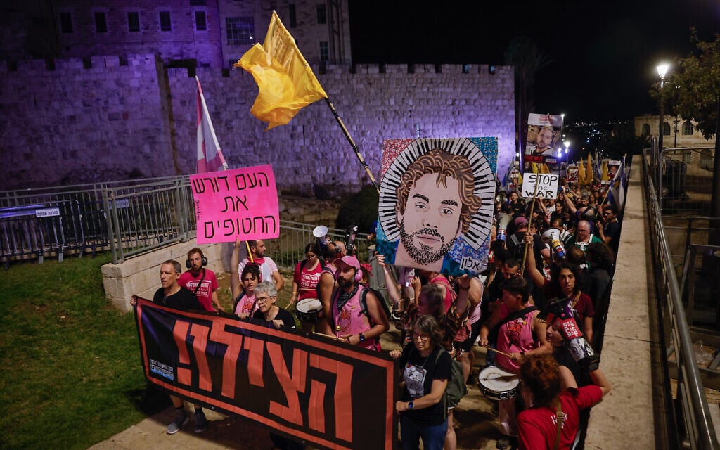Demonstrators march outside Jerusalem's Old City as they call for an end to the war in Gaza and the release of hostages held by Hamas, on September 20, 2025. (Yonatan Sindel/Flash90)