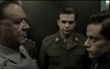 Screen capture showing Russell Crowe, left, as German Nazi leader Hermann Göring, facing Rami Malek, as US Army psychiatrist Douglas Kelley, in the historical drama movie 'Nuremberg.' (YouTube)