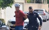 Police arrest a man at a hostage protest outside Education Minister Yoav Kisch's home in hod Hasharon, September 6, 2025. (Screenshot/X)