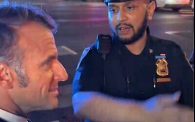 French President Emmanuel Macron faces off with a New York police officer, September 22, 2025. (Brut official screenshot via TikTok)