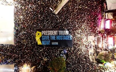 A massive banner calling for US President Donald Trump to push a hostage deal in Gaza is unfurled at Hostages Square in Tel Aviv during a protest on September 6, 2025. (OM/Hostages Families Forum)