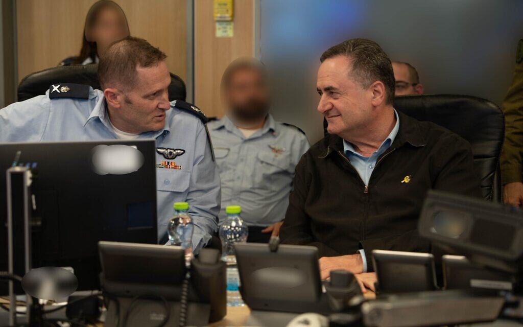 Defense Minister Israel Katz speaks with Israel Air Force chief Maj. Gen Tomer Bar as they observe strikes on Houthi targets in the Yemeni capital of Sanaa, on September 10, 2025. (Ariel Hermoni/GPO)
