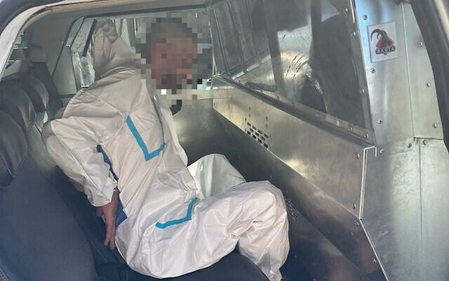 The suspect in the terror attack at Kibbutz Tzuba on September 12, 2025, in police custody. (Israel Police)