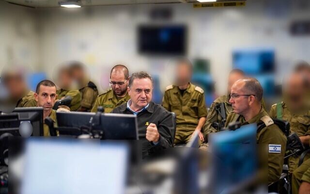 Defense Minister Israel Katz (center) speaks to officers at the 162nd Division headquarters during a major offensive in Gaza City, September 16, 2025. (Ariel Hermoni/Defense Ministry)