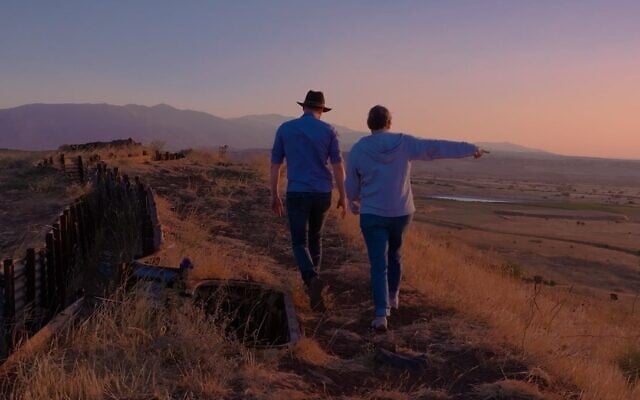 Filmmaker Eli Katzoff walks in the Golan Heights with retired IDF Col. Miri Eisin in the latest episode of web series 'Through the Land.' (Courtesy)