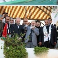 This handout photo issued by the Foreign Ministry on September 30, 2025, is said to show Ahmad Bahar, chairman of the Legislative Council in Gaza on behalf of Hamas speaking, and Zaher Birawi, head of Hamas’ Sector within the PCPA in the UK (second from left). (Foreign Ministry)