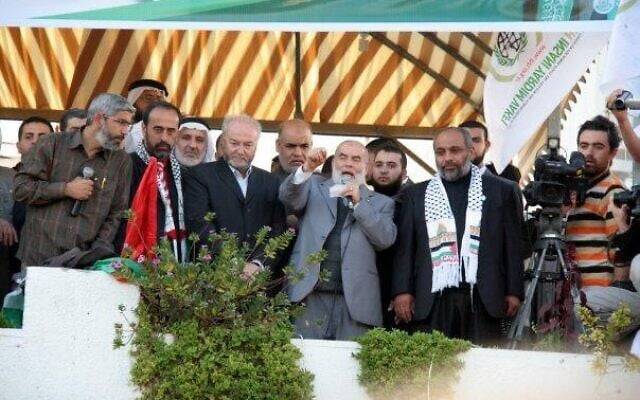 This handout photo issued by the Foreign Ministry on September 30, 2025, is said to show Ahmad Bahar, chairman of the Legislative Council in Gaza on behalf of Hamas speaking, and Zaher Birawi, head of Hamas’ Sector within the PCPA in the UK (second from left). (Foreign Ministry)